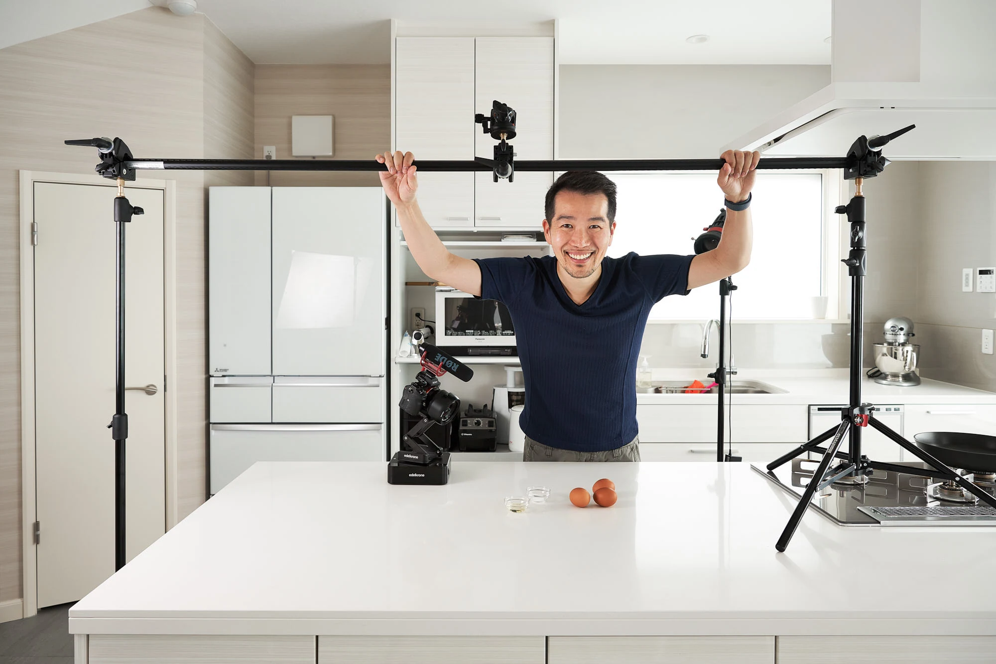 Marc Matsumoto in his Tokyo kitchen surrounded by cameras and an overhead filming rig